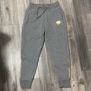 Nike Women’s Charcoal Joggers with Metallic Gold Details Like NEW!